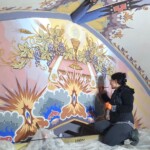 Conservation and reconstruction of the polychrome paintings by Władysław, Leon, and Kazimierz Drapiewski; work carried out as part of a team under the direction of Dr. habil. Sylwester Piędziejewski, 2025.
Photo: Dominika Glanc A person retouching polychromes of a religious kind